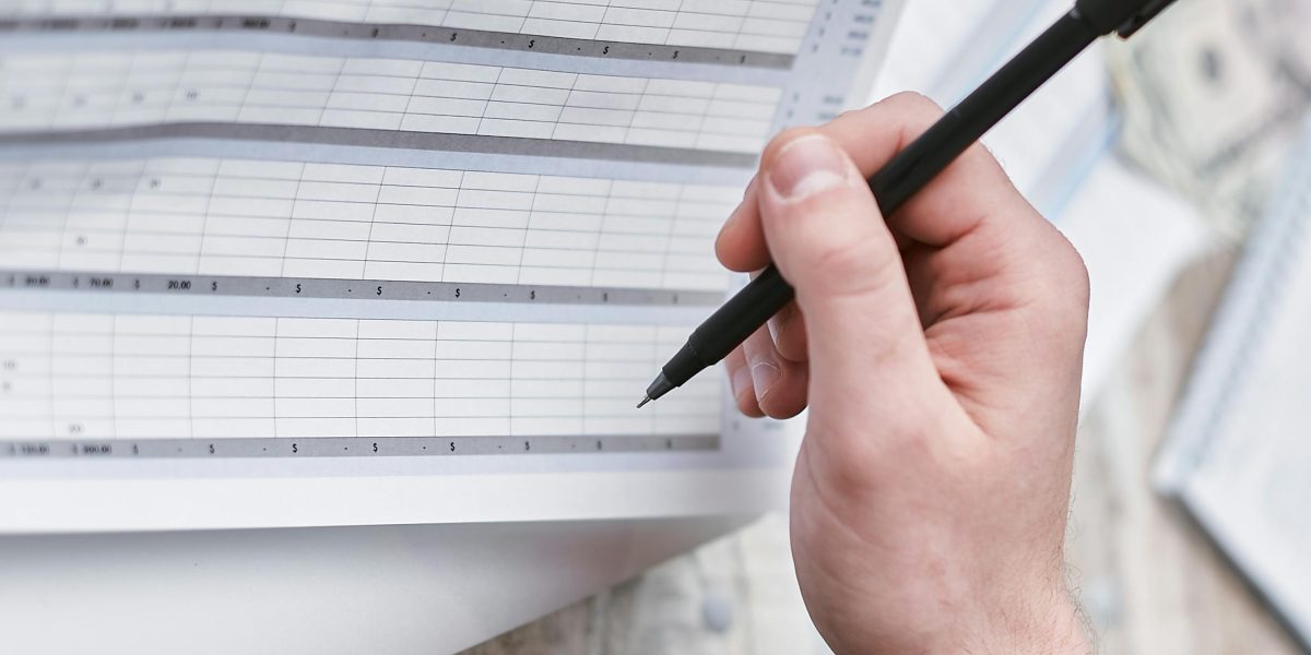 An expat investor reviewing financial documents, meticulously planning their Dubai real estate strategy.