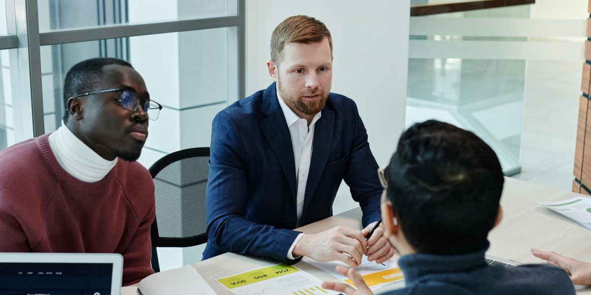 A team collaborating to develop a long-term growth and diversification strategy for their real estate portfolio.