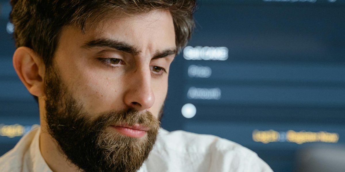 A person contemplating different investment strategies, looking for less stressful options.
