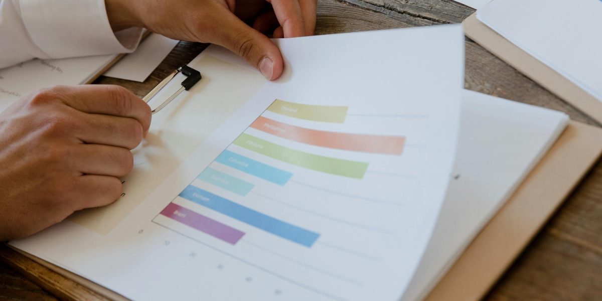 A person meticulously reviewing documents, symbolizing the critical importance of due diligence in real estate investment.