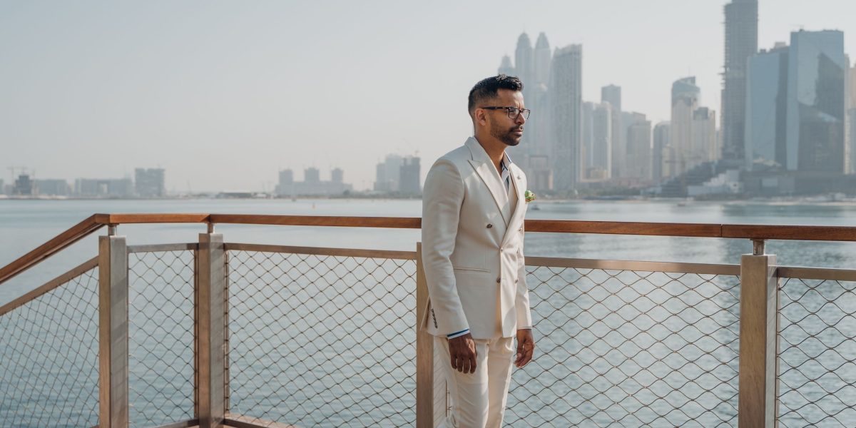 A confident investor surveying the bustling Dubai skyline, embodying the city's dynamic real estate opportunities.